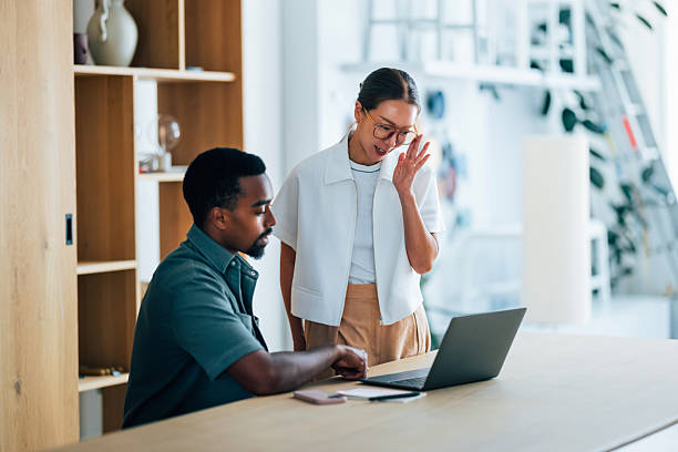 istock Team Collaboration at a Desk in a Modern Office Setting 2223853431