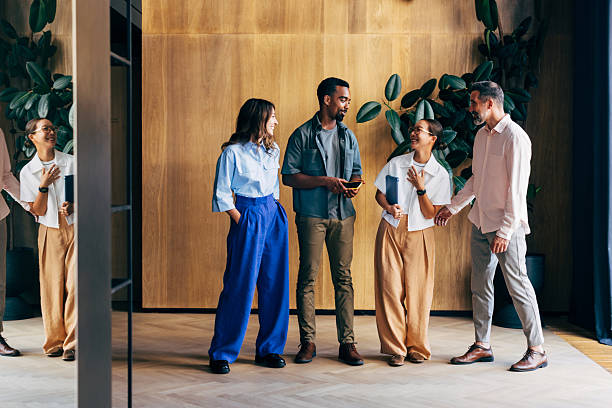 istock Group of Young Professionals Socializing in a Stylish Modern Office Space 2223853467