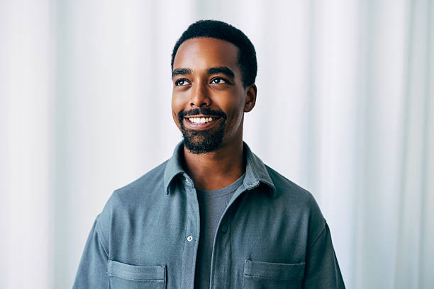 istock Smiling Confident Man in Casual Attire with Bright Clean Background 2223853470