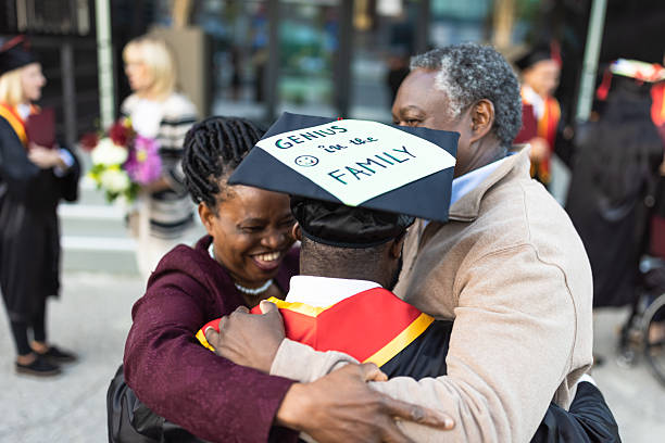 istock Graduation Celebration with Family Hug 2223855977