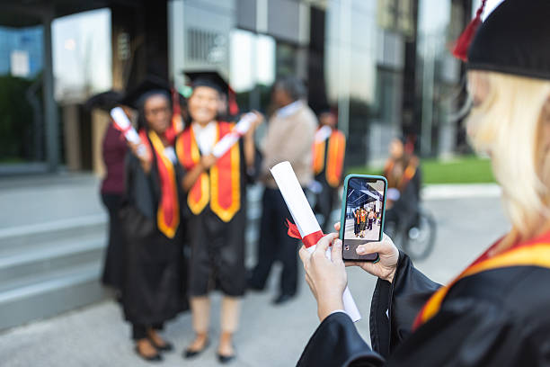 istock Graduates Celebrating with Diplomas 2223855993