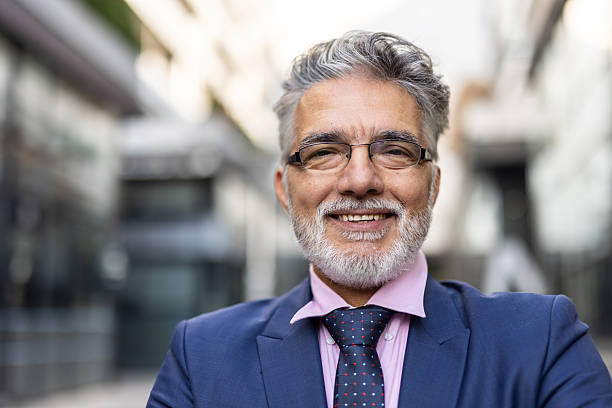 istock Self-Assured Male Executive Smiling Outside Modern Office 2223858247