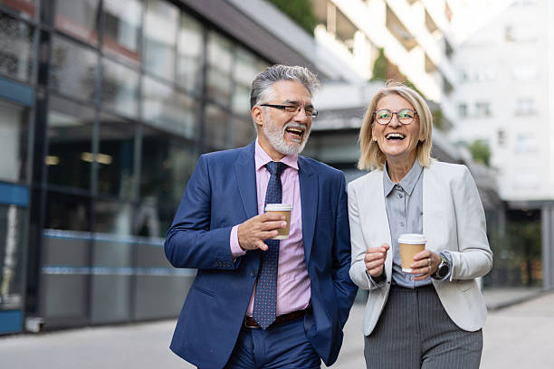 istock Professional duo enjoying coffee during afternoon stroll 2223858256