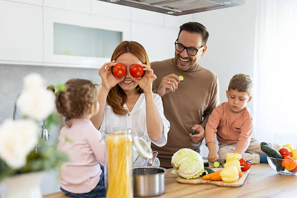 istock Cheerful Family Playing with Ingredients in Kitchen 2223859565