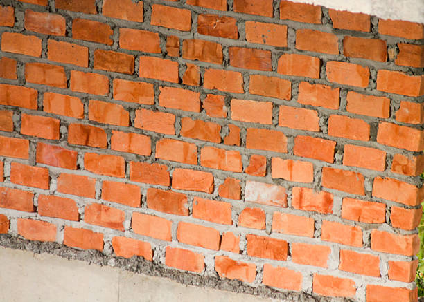 trowel and bricks isolated on white