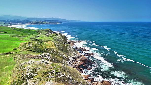 istock A breathtaking scenic coastal view featuring stunning green cliffs and a vast blue ocean 2223874411