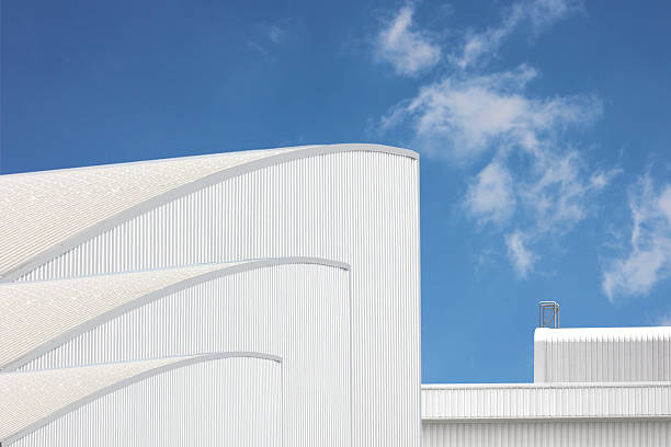 istock architecture design square shape corrugated wall geometric buiding. The factory warehouse is exterior decorated with corrugated texture to create a point of interest with beautyl 2223875331