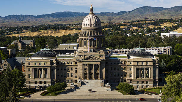 istock Architecture of Boise State Capitol building. Sandstone neoclassical building with dome against foothills backdrop in Idaho. 2223877267