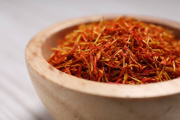 istock Aromatic saffron in bowl on table, closeup 2223877566