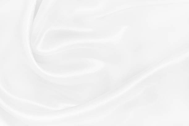 istock White fabric texture background, detail of silk or linen pattern. 2223877574