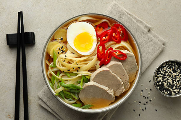 istock Delicious ramen in bowl served on light textured table, flat lay. Noodle soup 2223877683