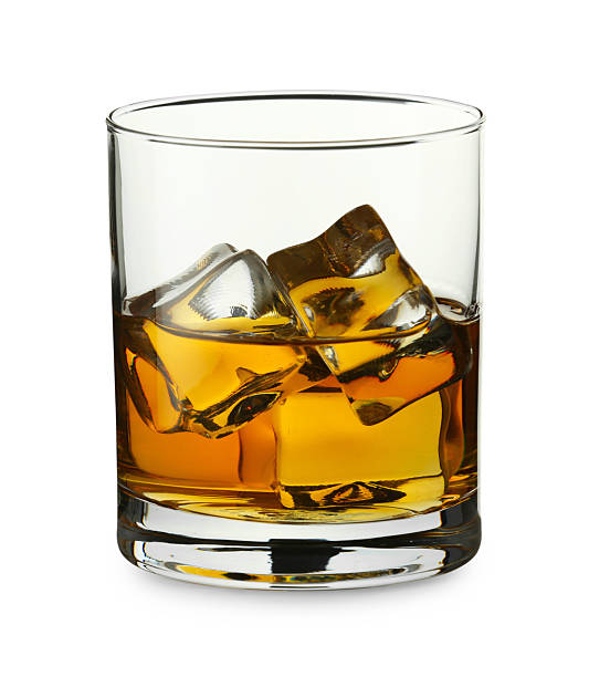 istock Whiskey and ice cubes in glass isolated on white 2223878089