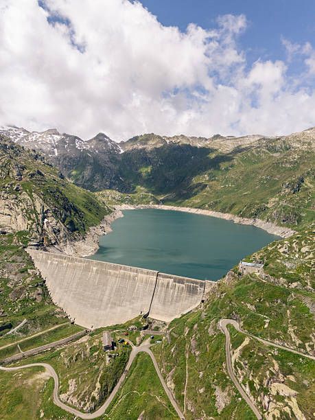 istock Large Concrete Dam Holding Mountain Reservoir 2223880970