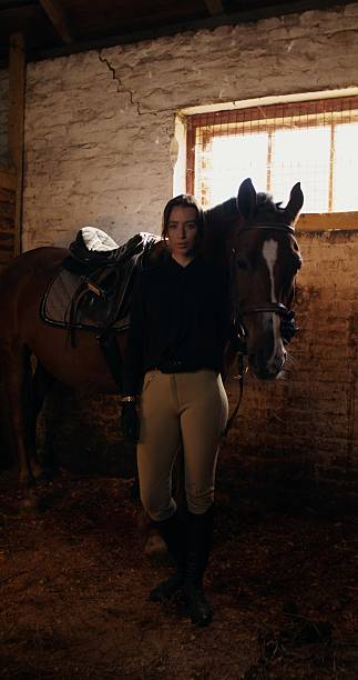 istock A woman with a horse 2223881912