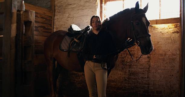 istock A woman with a horse 2223881916