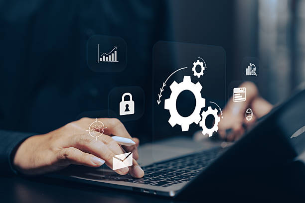 istock Business Process Automation: Hands using a stylus on a tablet, interacting with virtual gears, lock, chart, and other process icons, symbolizing workflow efficiency and technological solutions. 2223882070