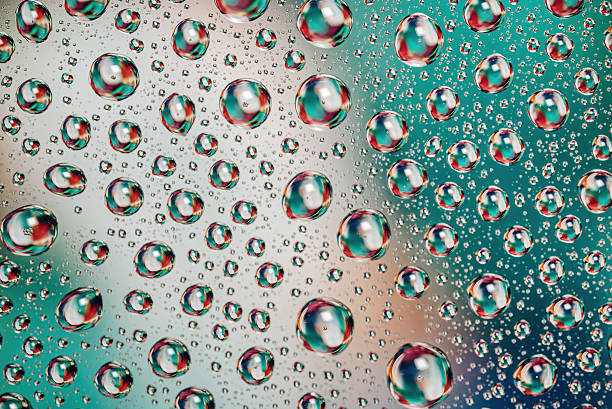 istock Vivid reflections in water drops forming colorful artistic composition, rain 2223882399