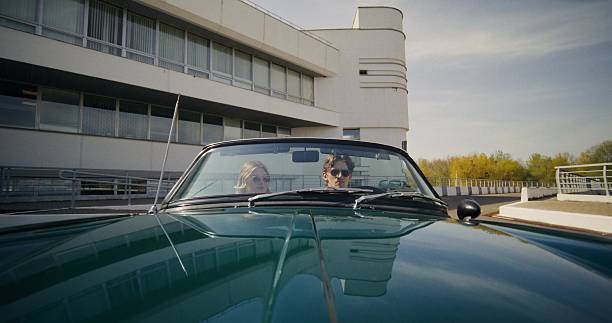 istock A young couple in a retro convertible 2223882500