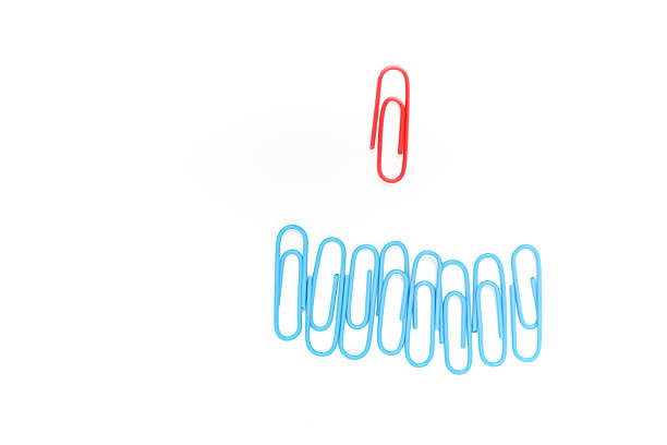 Close-up of clothespins on a rope with a patterned background