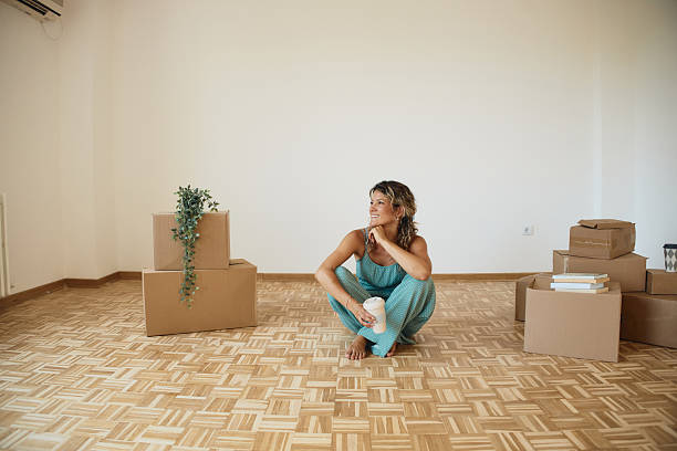 istock Single woman moving into new home 2223884719