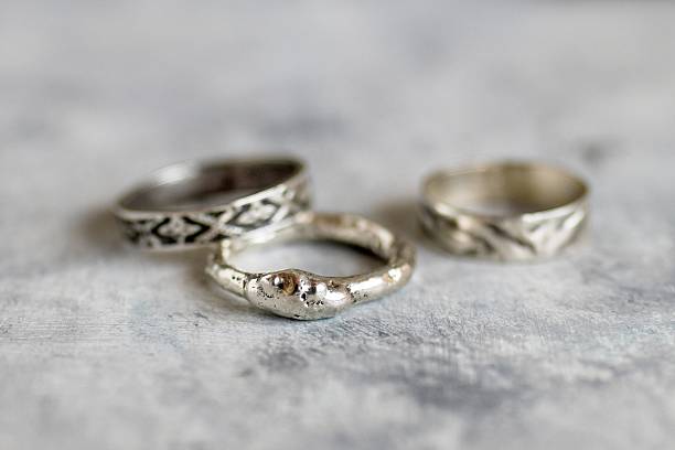 istock Handcrafted Silver Rings on Textured Surface Unique Jewelry Aesthetic, Close-up View. 2223887251