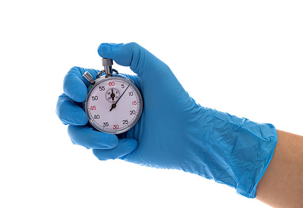 istock Doctor hand holding a stopwatch 2223890063