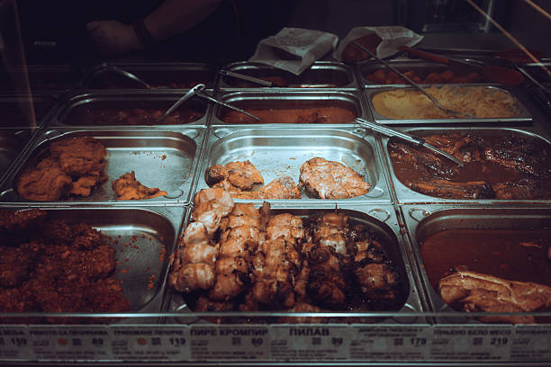 Ready meals with meat in the canteen, focus on the middle row with chicken.