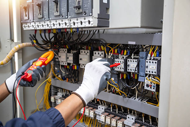 istock Checking the electrical system, an electrician is using an electric meter to check the electrical system at a control cabinet. for safety 2223890709