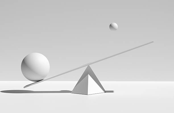 istock Balancing Spheres on Minimalist Seesaw 2223893117