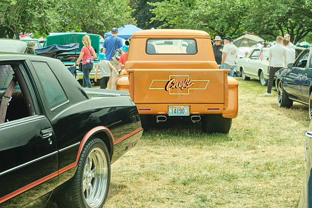 Auburn WA USA, July 4th, 2025 - For a classic Fourth of July tradition, vintage transportation enthusiasts can admire antique cars, trucks, and motorcycles