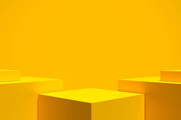 istock Yellow cubes creating a pedestal on a vibrant yellow background 2223893539