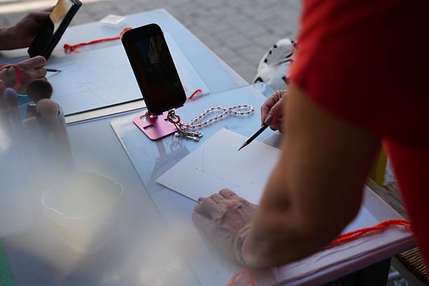 istock Artist Drawing at Outdoor Table with Smartphone References 2223893542