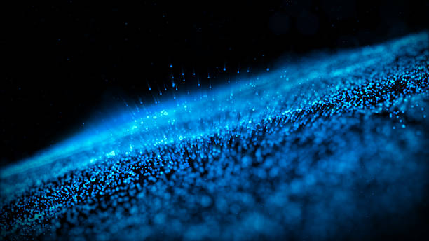 An captivating abstract background showcasing a luminous wave of blue particles against a stark black backdrop, ideal for themes of technology, space, or fluid dynamics.