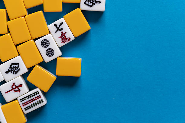 istock Mahjong tiles lined up on a blue background 2223893878