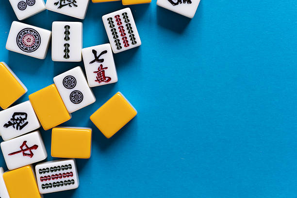 istock Mahjong tiles lined up on a blue background 2223893930