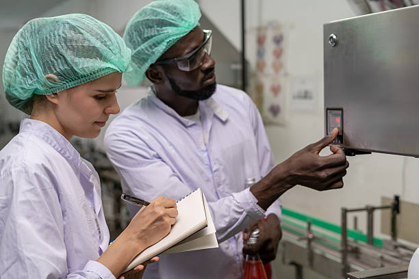 istock quality supervisor or food or pharmaceutical technician discuss about process control of food and drugs before send product to the customer. Production leader recheck parameter and productivity. 2223894782