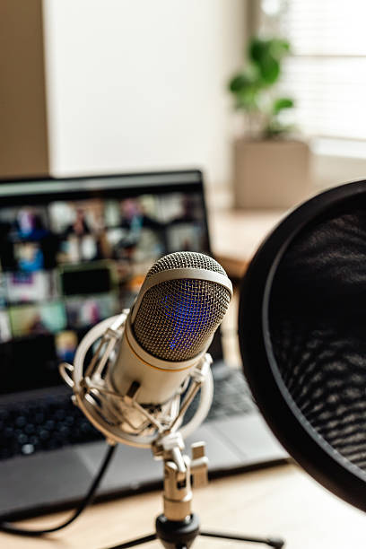 istock Podcast equipment - microphone and laptop computer. Home studio 2223900522