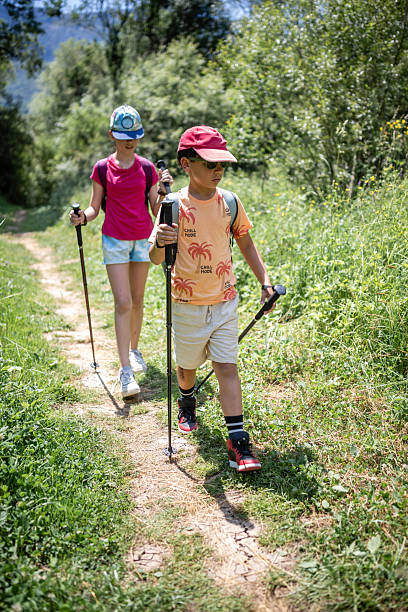istock Children enjoying a scenic summer hike together 2223900903