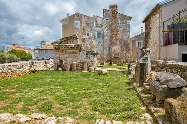 istock Ancient ruins and old houses in Porec, Croatia. 2223904178