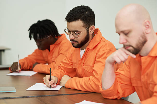 istock Multiethnic Young Adult Men Studying Together during Prison Education Program 2223904202