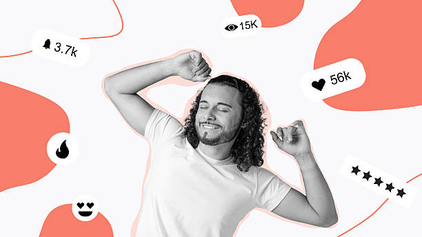 istock Happy young man enjoying himself while engaging with social media notifications indoors 2223906308