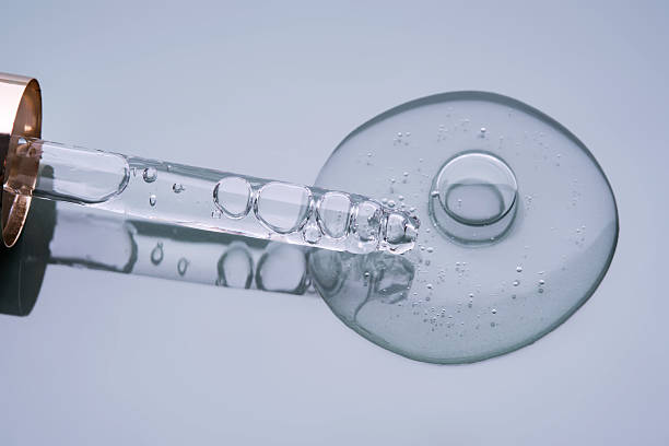 istock Pipette with serum on a blue background. Product texture. 2223906400