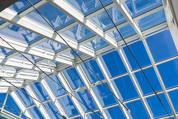 istock Geometric Glass Roof Reflecting Clear Blue Sky 2223906501