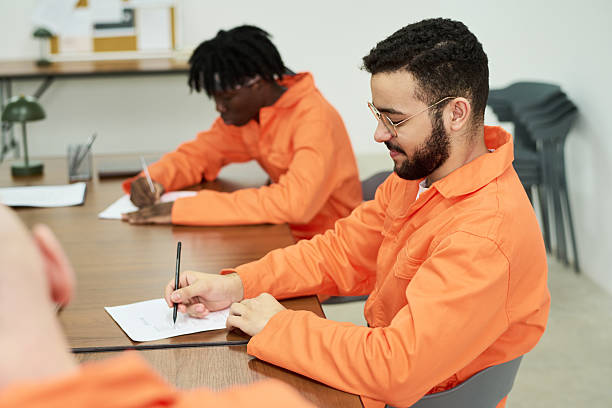 istock Young Adult Multiethnic Men Studying Together during Prison Education Program 2223906679