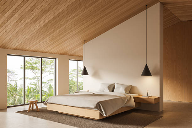 istock Minimalist bedroom interior with wooden elements, large windows, and neutral tones in a serene tropical setting, emphasizing natural textures and calmness. 3D Rendering 2223906875