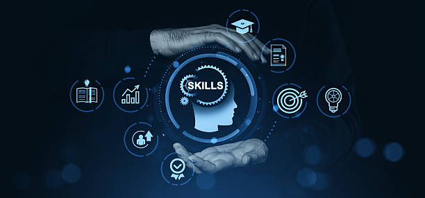 istock Human hands holding skill development icons with educational and career symbols in blue glow. 2223907834