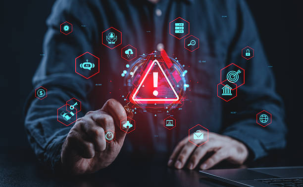 istock Cybersecurity risk alert interface with icons and digital warning symbol in red glow. 2223909081