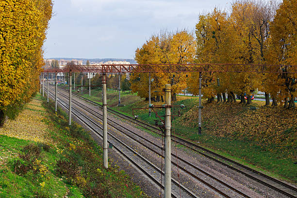 railroad ways in autumn October city transportation infrastructure iron track object perspective outdoor seasonal view