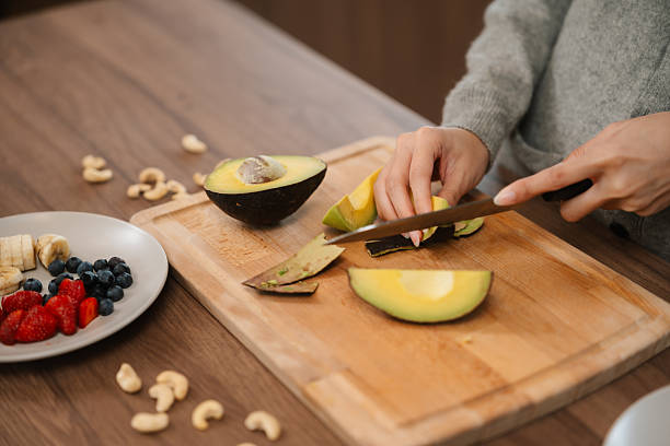 istock Health-Conscious Woman Preparing a Nutritious Meal Before Heading to Work on cozy kitchen 2223910072