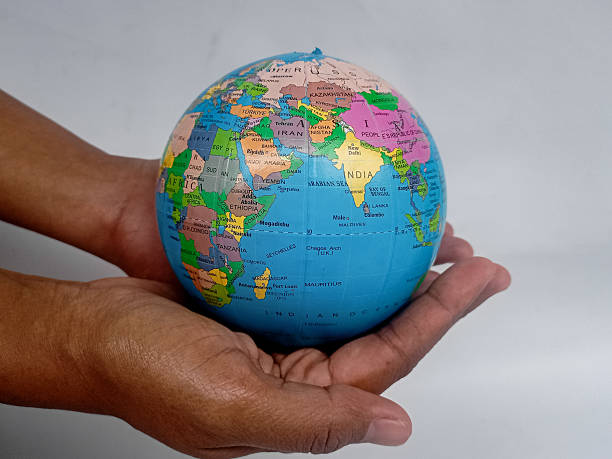 istock World protection concept. Globe in hands isolated on white background. 2223911753